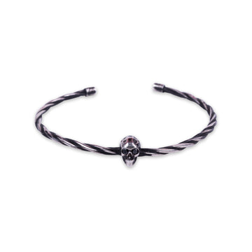 TWISTED SKULL MIDDLE WITH EMERALDS